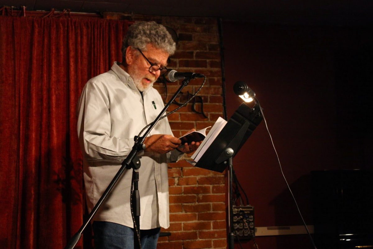 Photo of Richard Levine reading at Caffe Lena in Saratoga Springs, NY