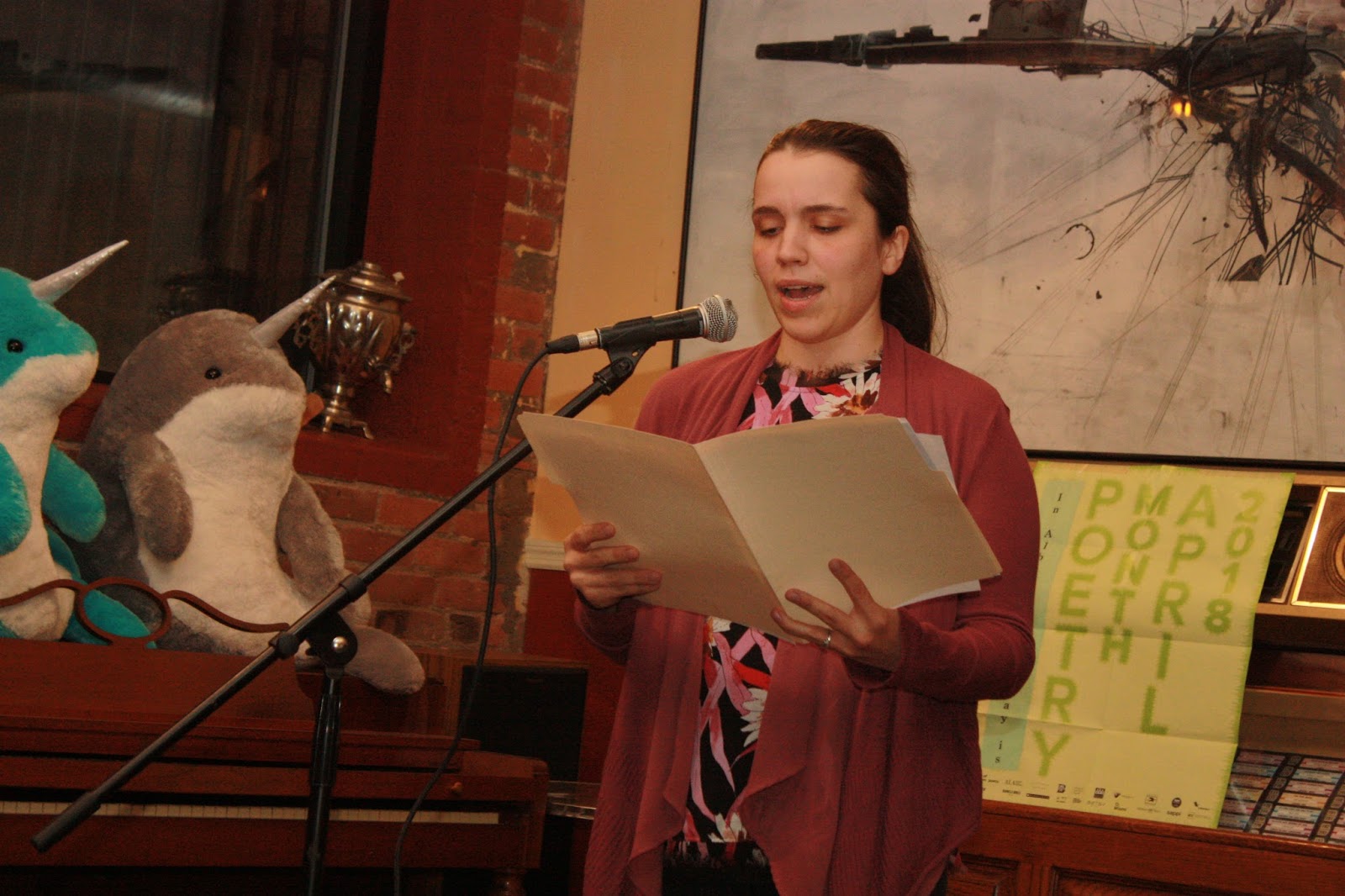 Photo of Danielle Pouliot reading at the Hudson River Coffeehouse in Albany, NY