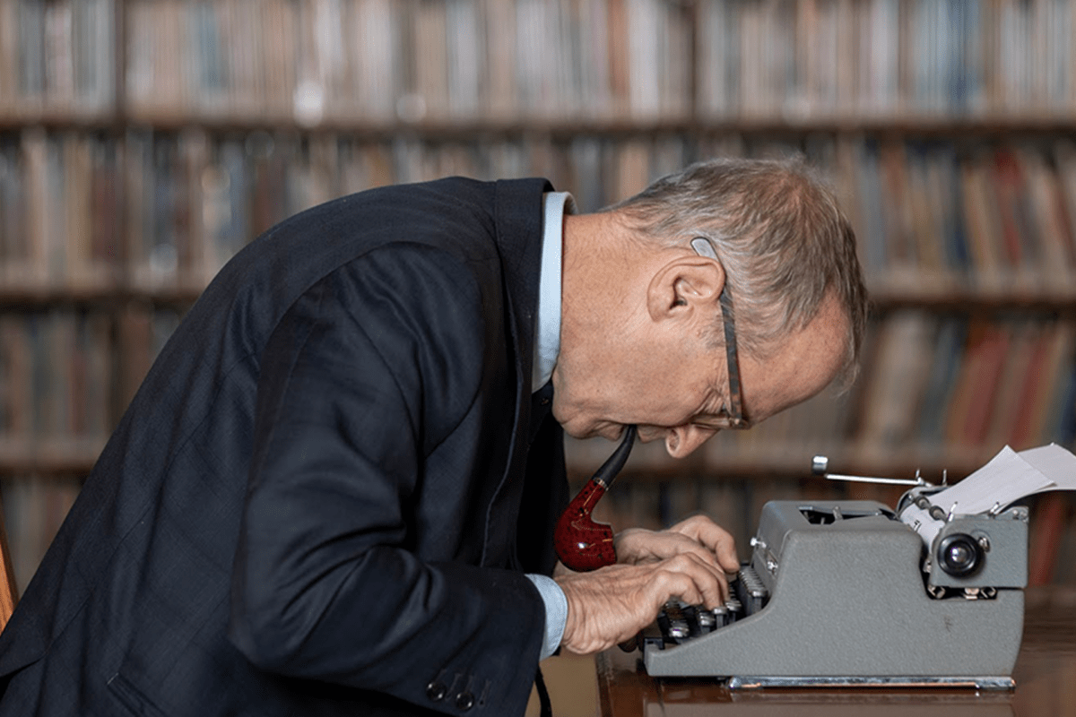 Photo of a man at a typewriter