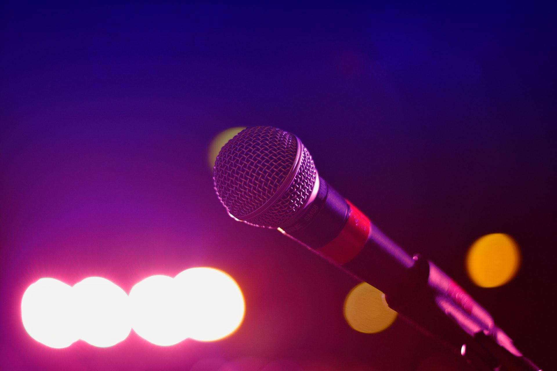 Microphone with purple background and lights