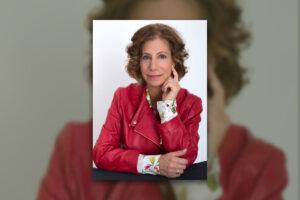 Photo of author Jodé Millman wearing a red jacket