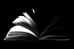 Black and White Photo of Opened Book