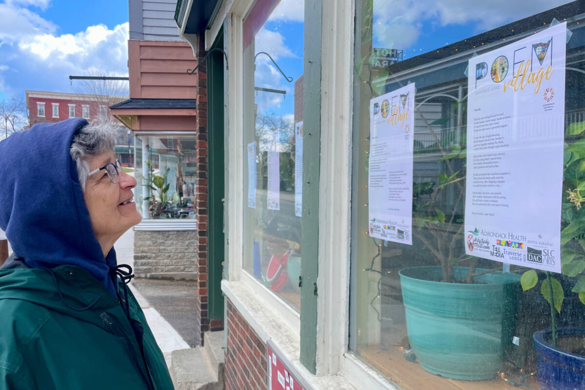 Photo of a woman looking at a shop window