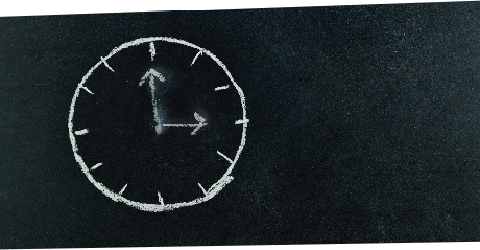 Clock on a chalkboard